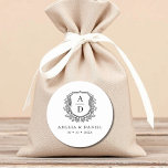 Black White Crest Modern Monogram Wedding  Classic Round Sticker<br><div class="desc">Add a touch of timeless elegance to your wedding with these Black White Crest Modern Monogram Wedding Classic Round Stickers. Featuring a crisp black and white design, a refined crest emblem, and a personalized monogram, these stickers are perfect for sealing envelopes, decorating favors, or enhancing your wedding stationery. Their minimalist...</div>