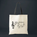 Black & White Custom Text Music Teacher/Student Tote Bag<br><div class="desc">This personalized music-themed tote bag is the perfect blend of practical and thoughtful for any music lover, teacher, or performer. Featuring a bold black treble clef and flowing musical notes across the front, the design is both expressive and stylish. The customizable text section lets the customer add their own name,...</div>