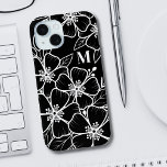 Black White Floral Monogram Initial iPhone 15 Case<br><div class="desc">Chic Black White Floral Monogram Initial iPhone 15 Case. A fun but elegant phone case with girly black and white flower outlines. A playful flower pattern frames a chic serif font simple initial monogram. The fun part is you can change out ALL of the colors!! You can not only change...</div>