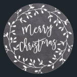Black White Merry Christmas Chalkboard Wreath Classic Round Sticker<br><div class="desc">Chic and contemporary white wreath on black chalkboard creates a fresh and modern Christmas envelope seal. Merry Christmas is written in a hip and trendy font that complements the wreath perfectly.</div>