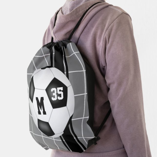 black white soccer ball with goal net detail drawstring bag (Insitu)