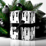 Black & White Trendy Abstract Nutcracker Pattern Wrapping Paper<br><div class="desc">Our Nutcracker Christmas Symphony Collection incorporates the modern elegance of black ink line-drawn nutcracker solider art, minimalist styling, This modern mix of elegance and abstract style, creates a bold and trendy Christmas collection. All artwork contained in this black and white nutcracker abstract & trendy Christmas wrapping paper are hand-drawn original...</div>