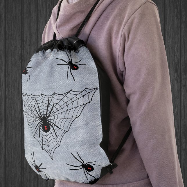 Black Widow Spider Web Halloween Gothic Drawstring Bag (Black widow spiders in triangular black spider web on white painted look drawstring backpack.)