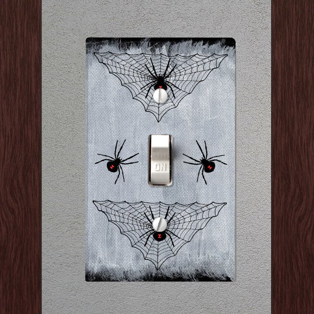 Black Widow Spider Web Halloween Gothic Light Switch Cover (Creepy black widow spiders black triangle shaped webs on black and white electrical wall plate.)