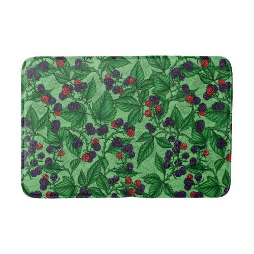 Blackberries on green bath mat