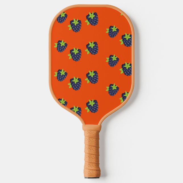 Blackberry fruit on orange pickleball paddle (Front)