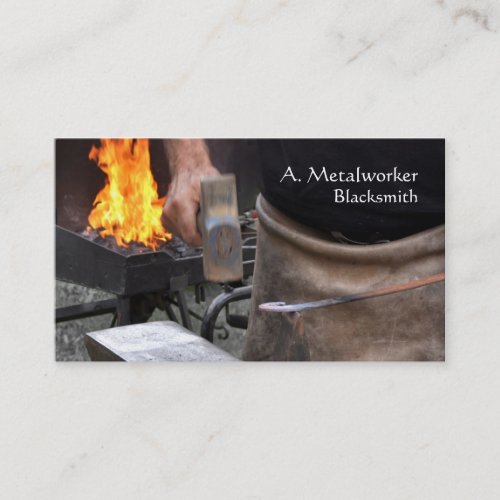 Blacksmith at work with forge business card