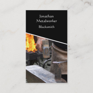 Blacksmith hammering hot iron business card
