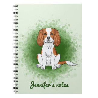 Blenheim Cavalier King Charles Spaniel On Green Notebook