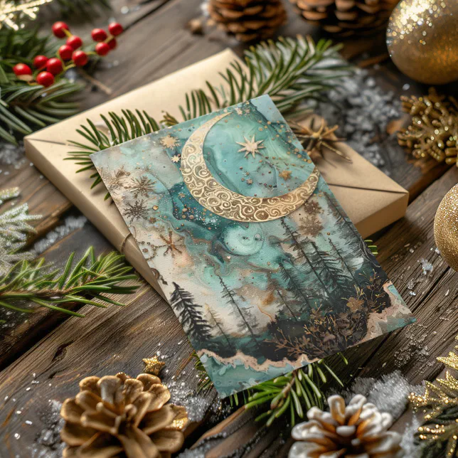 A Winter Solstice-themed card laying on a table with pinecones, ornaments, glitter, and small Christmas tree branches scattered around it.