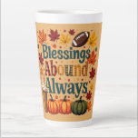 Blessings Abound Always Autumn Design Latte Mug<br><div class="desc">Celebrate the warmth of fall with this cheerful "Blessings Abound Always" design, bursting with cozy seasonal vibes. Surrounded by vivid autumn leaves in shades of crimson, gold, and burnt orange, this playful composition features plaid-patterned typography that radiates rustic charm. The inclusion of pumpkins, a classic football, and a whipped cream-topped...</div>