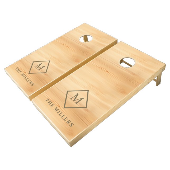 Blond pine wood gold frame monogram cornhole set (Angled)