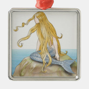 Blonde mermaid sitting on sea rock, side view. metal ornament