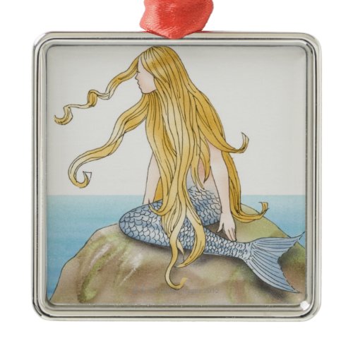 Blonde mermaid sitting on sea rock, side view. metal ornament