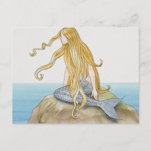 Blonde mermaid sitting on sea rock side view postcard