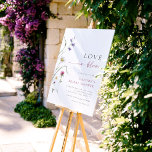 Bloom Wildflower Bridal Shower Welcome Sign<br><div class="desc">A welcome sign to match our Love in Bloom Wildflower Bridal Shower collection. This design features graceful hand-painted watercolor wildflowers on the left-hand side, balanced by elegant text on the right. The phrase “Love in Bloom” is written in flowing script, complemented by the bride’s name in chic purple capitals. The...</div>
