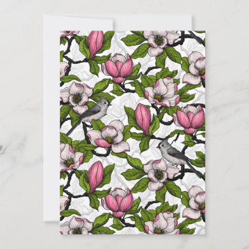 Blooming magnolia and titmouse bird