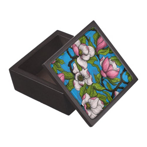 Blooming magnolia on blue gift box