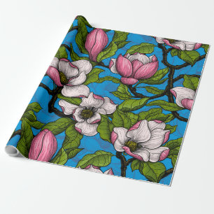 Blooming magnolia on blue wrapping paper