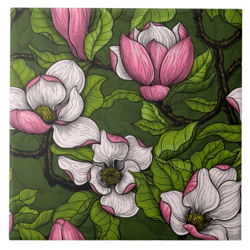 Blooming magnolia on dark green ceramic tile
