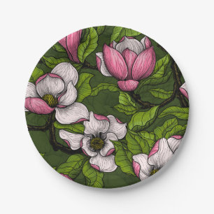 Blooming magnolia on dark green paper plates