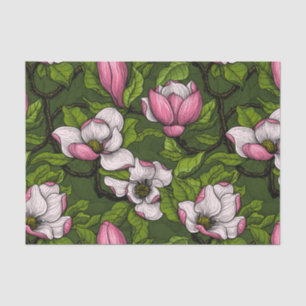 Blooming magnolia on dark green tissue paper