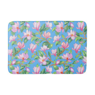 Blooming magnolia on sky blue bath mat