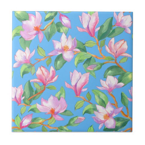 Blooming magnolia on sky blue ceramic tile