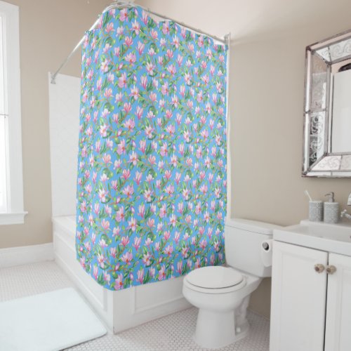 Blooming magnolia on sky blue shower curtain