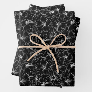 Blooming White Hibiscus Flowers on Black Wrapping Paper Sheets