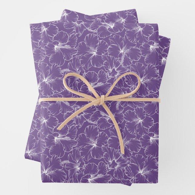 Blooming White Hibiscus Flowers on Purple Wrapping Paper Sheets (In situ)