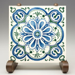 Blossoming Azure Ceramic Print Tile<br><div class="desc">The Blossoming Azure Ceramic Print Tile encapsulates the essence of Mediterranean charm, featuring a symmetrical floral design that blooms in a harmony of azure blue and lush green. This print captures the delicate artistry of traditional hand-painted ceramics, presenting a flat and smooth rendition that retains the original's vibrant colors and...</div>