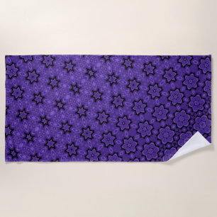 Blossoming purple star transformation beach towel