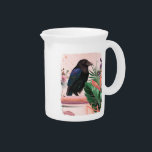 BlossomRaven in Tropical Garden Beverage Pitcher<br><div class="desc">The picture shows a majestic raven with shiny black feathers and blue accents, which is proud of a branch. It is surrounded by lush green leaves with soft pink and orange tones, creating a vibrant tropical atmosphere. A splash and abstract lines give the work depth and a mysterious, quiet energy...</div>
