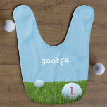 Blue and Green First Birthday Funny Golf Cute Boy Baby Bib<br><div class="desc">Suitable for all future golfing champions and dads that dribble. Golf balls on the green,  with a number that can be seen. Catching those dribbles is the aim,  add your little golfer's name.</div>