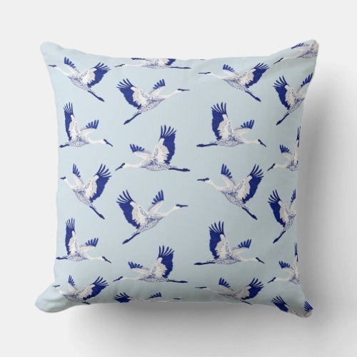 Blue and white cranes throw pillow