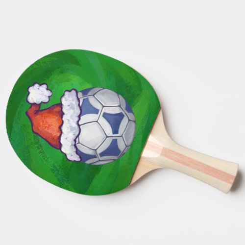 Blue and White Festive Soccer Ball on Green Ping Pong Paddle