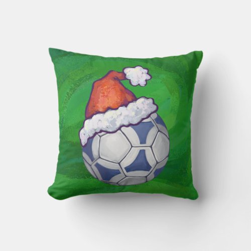 Blue and White Festive Soccer Ball on Green Throw Pillow