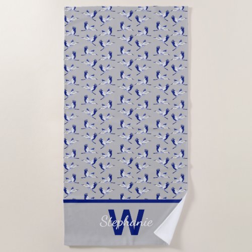 Blue and white flying cranes  beach towel