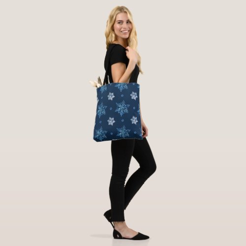 Blue and white snowflakes tote bag
