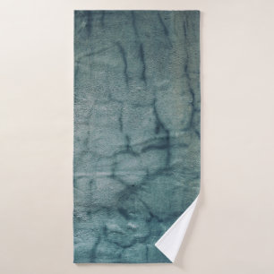 Blue and white textile with water droplets bath towel