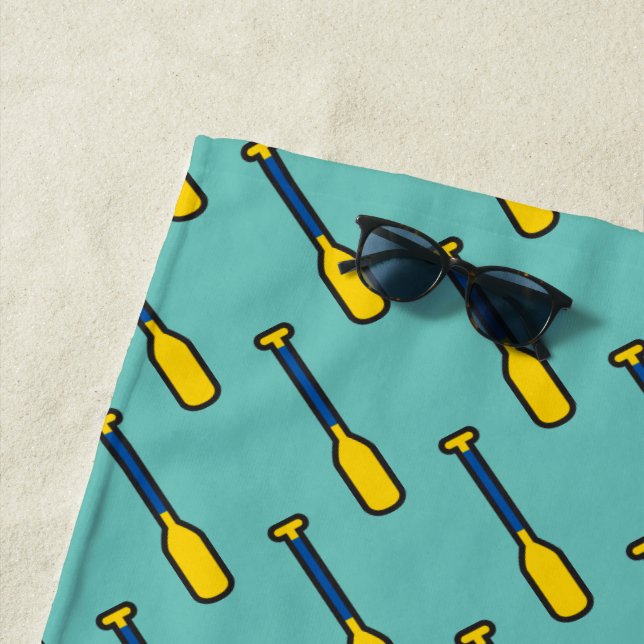 Blue And Yellow Raft Paddles on Teal Beach Towel (In Situ)