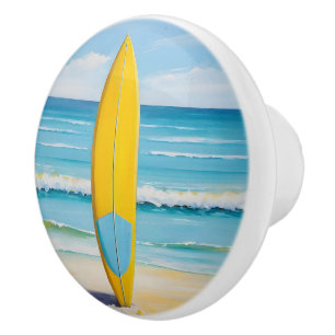 Blue and yellow surf board on the beach ceramic knob