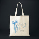 Blue Bow She's Tying the Knot Bachelorette Party Tote Bag<br><div class="desc">Introducing the Blue Bow She's Tying the Knot Bachelorette Party Tote Bag – the perfect accessory for celebrating the bride-to-be! This chic tote bag features a stylish pink bow design with the phrase "She's Tying the Knot, " adding a touch of elegance to any bachelorette party. Made from durable, eco-friendly...</div>