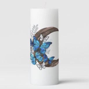 Blue butterflies on wooden crescent pillar candle