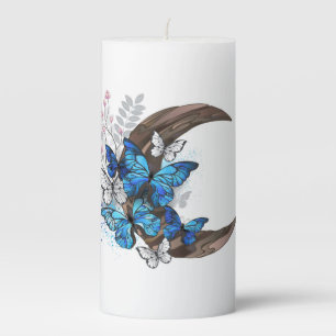 Blue butterflies on wooden crescent pillar candle