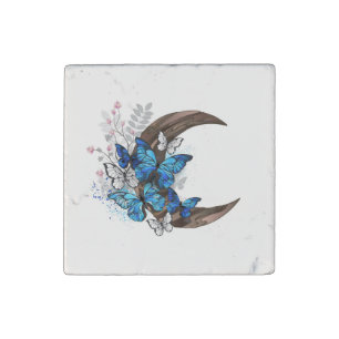 Blue butterflies on wooden crescent stone magnet