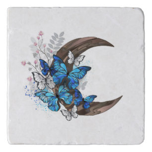 Blue butterflies on wooden crescent trivet