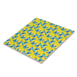 Blue butterflies pattern on yellow ceramic tile