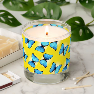 Blue butterflies pattern on yellow scented candle
